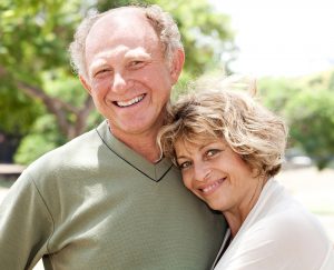Loving, handsome senior couple posing in style
