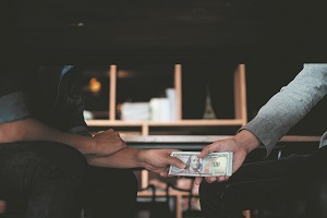 Businessmen giving money