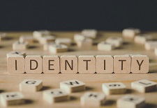 Scrabble tiles spelling 'identity'